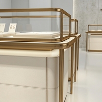Comptoir de présentation de bijoux de luxe personnalisé avec cadre doré, vitrine en verre LED pour boutique de diamants et de pierres précieuses