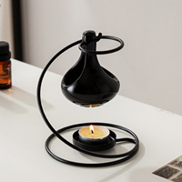 Diffuseur d'arômes créatif moderne et minimaliste en céramique noire en forme de goutte d'eau, lampe à huile essentielle, chauffe-cire pour bougies domestiques
