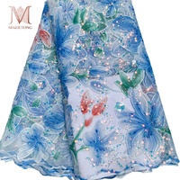 Nouveau tissu en dentelle de maille brodé de perles florales, de tubes et de paillettes scintillantes pour robe de mariée et de soirée