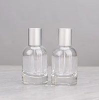 Venta al por mayor directa de fábrica: Botella de perfume redonda de vidrio transparente de 30ml, 50ml, 100ml con tapa y serigrafía para esmalte de uñas/aceite.