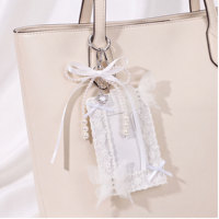 Porte-cartes en dentelle blanche avec chaîne de perles, nœud en satin et pendentif cœur en strass, accessoire de sac de mariée