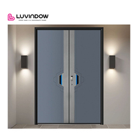 Porte d'entrée moderne en fer forgé géant avec design en acier cintré, fonction antivol pour application en villa
