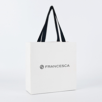 Sac en papier cartonné blanc de luxe avec poignée en ruban gros-grain noir mat 250 g/m², personnalisé avec logo imprimé OEM, pour boutique de vêtements et bijoux