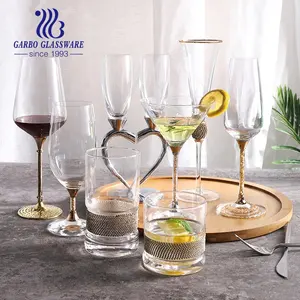 Online Hand Blown Glass Champagne Toasting Flute with Decorative Rhinestone Metal Heart Stem with Golden Rim Gift for Wedding