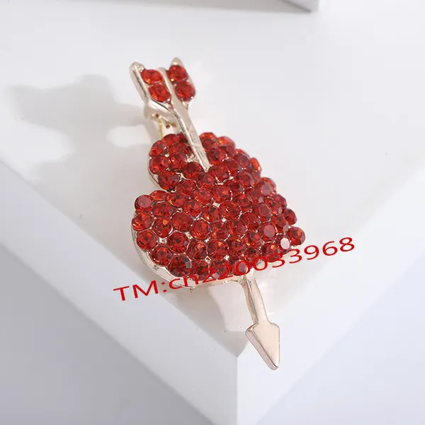 Valentine's Day gift Alloy red rhinestone one arrow through the heart brooch Fashion temperament Korean pin suit cape buckle pin