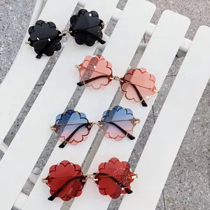 2022 nuovi occhiali da sole alla moda per bambine occhiali da sole per bambini a forma di fiore rotondo senza montatura di lusso per feste di alta qualità