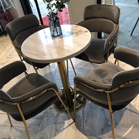 Hôtel nordique moderne luxe métal PU cuir rembourré chaise de salle à manger de luxe Table en marbre ensemble groupe pour 4 personnes