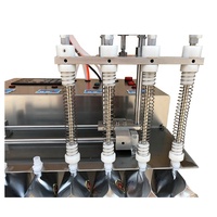 Poche debout avec bec verseur Machine de remplissage capsulage Bureau 4 buses Jus Eau Lait Thé Machine de remplissage liquide pour sacs à bec