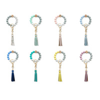 Porte-clés tendance en perles de silicone avec pompon en cuir PU, bracelet portable pour clés de voiture, ornement suspendu
