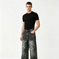 Pantalon en jean noir délavé coupe baggy avec motif totem tourbillonnant en strass brillants, jambe droite, style streetwear oversize