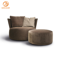 Fauteuil d'appoint moderne en tissu bouclé, fauteuil rond crème blanc avec courbes douces et base dissimulée, pour salon d'hôtel
