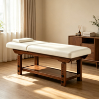 Table de massage professionnelle en bois bleu foncé sur mesure avec coussin de tête et tiroir pour usage en salon de beauté, SPA, hôtel, salle de sport ou salon.