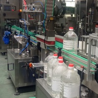 Ligne de machines de capsulage et d'étiquetage entièrement automatiques pour petites bouteilles, fûts en plastique, bouteilles en verre, lait, boissons et produits chimiques, haute précision, économe en énergie