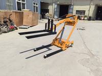 Mini chariot élévateur électrique d'une capacité de charge de 500 kg, adapté à une utilisation comme petit transpalette électrique dans les ateliers
