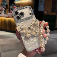 Coque de téléphone à chaîne papillon dégradé avec nœud et coquillage pour iPhone 17 16 15 Pro Max, avec breloques diamantées et lanière scintillante