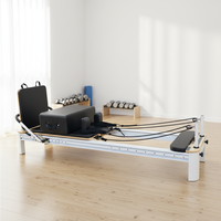 Appareil de Pilates Reformer à usage commercial avec barre de pression à rail complet