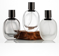 Botella de perfume de repuesto de vidrio transparente esmerilado 30ml reciclable de lujo con tapa de pulverización de bomba negra