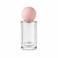Flacon de parfum en verre transparent de 50 ml/100 ml avec bouchon rose, forme cylindrique, vaporisateur à pompe, rechargeable, logo personnalisé disponible