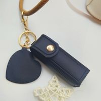 Étui portable pour rouge à lèvres et baume à lèvres, nouveau style, porte-monnaie en polyuréthane, porte-clés, pendentif, mini miroir de maquillage en forme de cœur pour filles