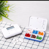 Minuterie intelligente personnalisée Mini boîte à médicaments portable Conteneur à pilules électronique Rappel de réveil à écran numérique en plastique durable