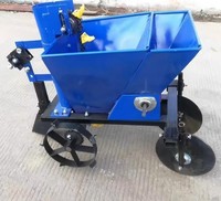 Semoir à pommes de terre monorang à traction, haute productivité, fabriqué à Henan, Chine, équipement de plantation mécanique pour l'ensemencement agricole