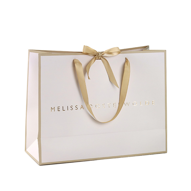 Custom Paper Bag Champagne Gold Elegant Packaging Bags with Featuring Debossed Company Logo for Luxury Retail Gifting Occasions