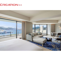 Ensemble de mobilier hôtelier sur mesure pour suite vue mer avec chambre et salon
