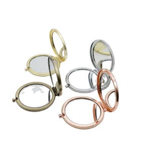 กระจกแต่งหน้าพกพาแบบโลหะและกระจก ขนาดเล็ก 70 มม. สองด้าน สกรีนโลโก้ได้ 3 สี สำหรับใช้ในบ้านอัจฉริยะ ปี 2024 - Product Image 1