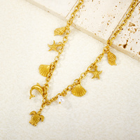 Collier Posey classique et tendance en acier inoxydable plaqué or 18 carats avec motif coquillage et étoile de mer, style femme