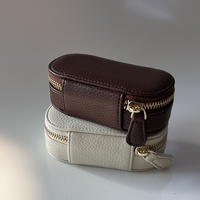 Boîte à bijoux de voyage ovale en cuir PU vegan grainé avec fermeture éclair dorée, mini, personnalisable avec logo et couleur