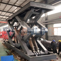6 tonnes 10000kg 15 tonnes 20 tonnes de capacité de chargement plate-forme hydraulique stationnaire d'ascenseur de cargaison de ciseaux 10 tonnes ont utilisé l'ascenseur de cargaison