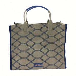 กระเป๋าผ้าแคนวาสสีขาวสำหรับผู้หญิง ทนทาน กันน้ำ ใช้ซ้ำได้ หูหิ้วริบบิ้นน่ารัก พร้อมช่องใส่ของแบบสาน เหมาะสำหรับช้อปปิ้งประจำวันและไปเที่ยวชายหาด - Product Image 1