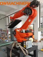 Le vide d'air de robot de palletisation de KUKA aspire le carton d'aspiration