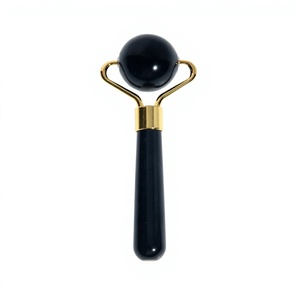 Rouleau de massage facial en jade naturel avec poignée dorée pour la relaxation et les soins de beauté - Product Image 3
