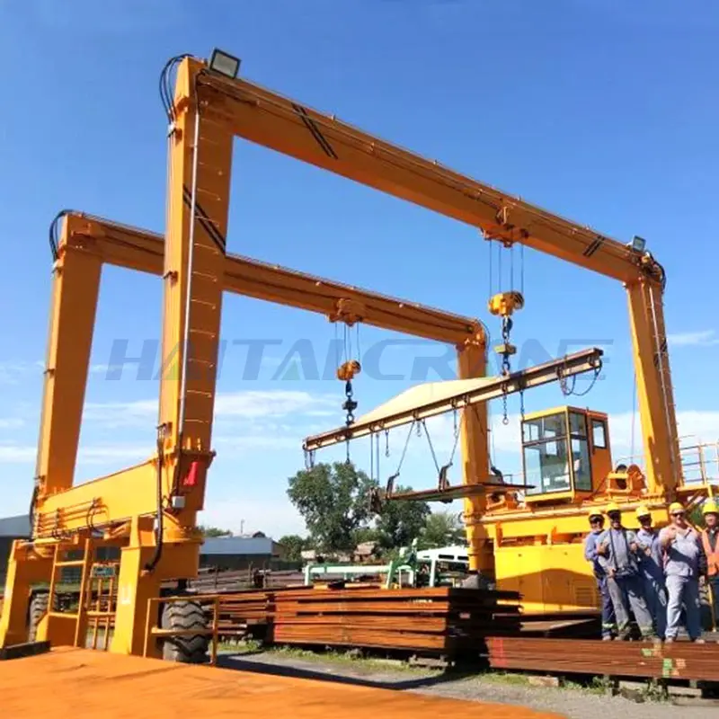 Fabricantes de grúas de pórtico de neumáticos de goma ferrocarril 50 ton 60 ton puente Straddle Carrier grúa pesada para mover y ceñir