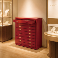 Commode moderne en bois massif à 9 tiroirs avec poignées dorées, commode haute rouge pour le rangement de bijoux, montres et lunettes