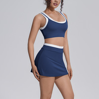 Nouvel Arrivage Ensemble de Yoga pour Femme : Soutien-gorge de Sport Sexy à Découpes au Dos et Contraste de Couleurs, et Jupe-short de Tennis Respirante Taille Haute