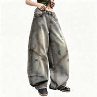 Pantalon en jean délavé effet dégradé avec patchwork à lames courbes, coupe droite ample, style streetwear, taille haute, jambe large
