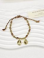 Bracelet en chaîne dorée avec perles de cristal colorées, breloques pendantes en zircon et gemmes de formes variées (cœur, carré, ovale, goutte d'eau, marquise)