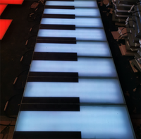 Plancher de danse LED interactif à musique de piano à changement de couleur RVB extérieur commercial pour jardin marché parc