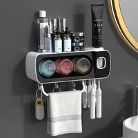 Porte-brosse à dents de salle de bain OEM perforation libre rince-bouche ventouse brossage mural avec distributeur de dentifrice