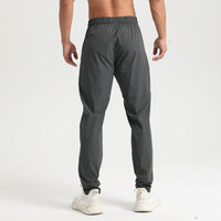 Aoyema Pantalons de sport pour hommes Pantalons de jogging pour la course à pied Pantalons de survêtement en nylon pour l'entraînement à séchage rapide Pantalons de fitness de haute qualité