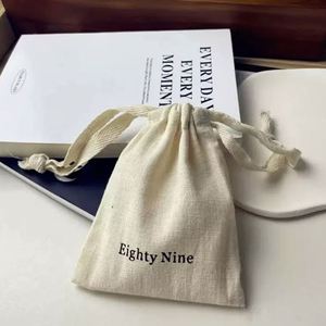High Quality Cotton <b>Drawstring</b> <b>Pouch</b> Custom Cotton Packaging Bag Beige Cotton <b>Drawstring</b> Bag With With Herringbone String - Product Image 1