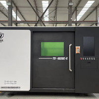 Machine de découpe laser entièrement fermée haute vitesse 3015 avec plateforme d'échange 6 kW, adaptée à la découpe de plaques minces et au traitement