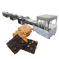 Ligne de production de barres granola Moxin, très demandée |   Machine automatique pour barres de céréales à l'avoine, au sésame et aux cacahuètes et mélangeur à nougat