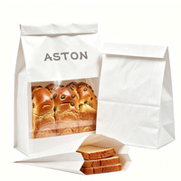Sac à pain en papier kraft blanc avec logo personnalisé, fenêtre transparente et fermeture à lien métallique, emballage alimentaire en papier pour sandwichs, toasts et pains.