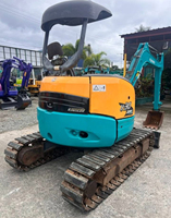 Mini-excavatrice Kubota U30 d'occasion, 3 tonnes, sur chenilles, compacte, pour travaux agricoles et de construction, avec accessoire de préhension.