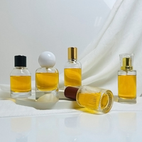 Pulvérisateur de parfum rond personnalisé de 50ml atomiseur vide bouteille en verre de parfum pour hommes avec bouchon en forme de boule de fond de montagne de neige de volcan