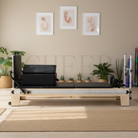 Reformer Pilates en érable avec barre de pieds coulissante pour équipement de fitness à domicile favorisant l'entraînement de renforcement du tronc