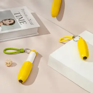 ほこりの服ペットの髪のための工場卸売再利用可能なポータブルバナナ形状リントローラーリムーバーブラシ